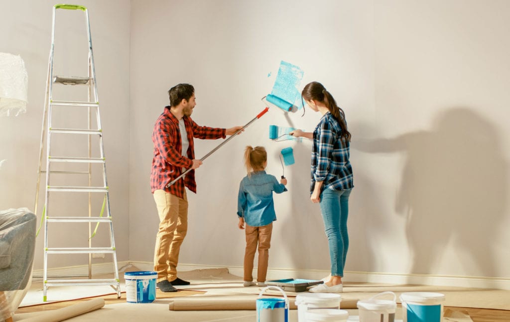family painting their walls