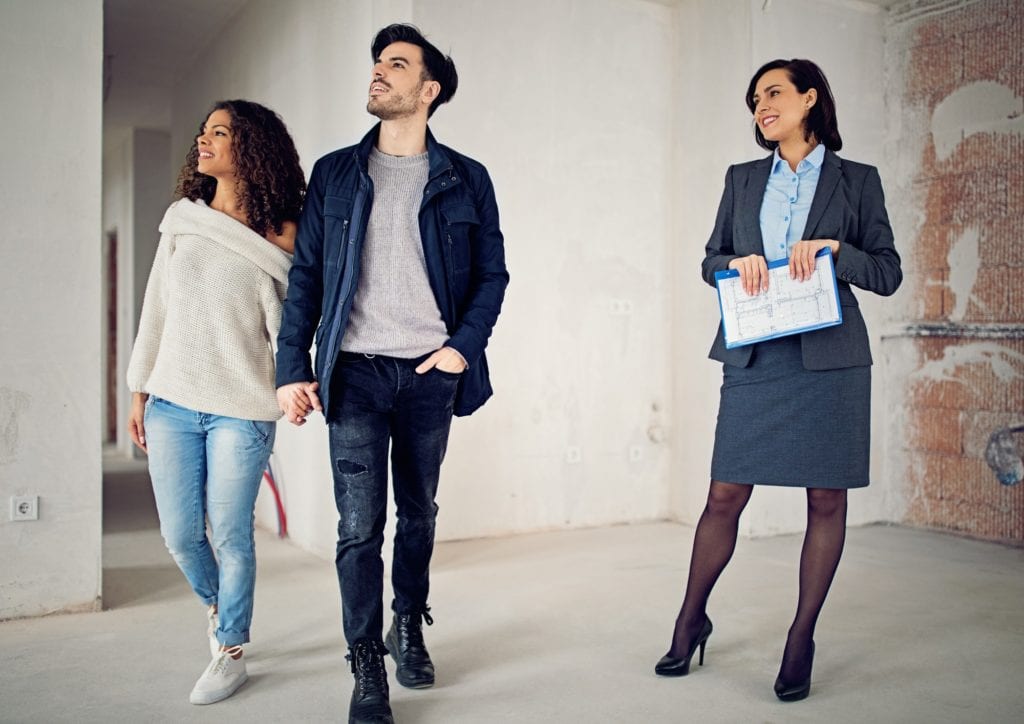 couple with their agent viewing the house they are about to rent